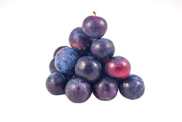 Sweet plum, prunes isolated on white background, Group of plums, prunes with leaf isolated on a white background. Fresh of plum, prunes fruit that helps in digestion, suitable for constipation.