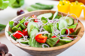 vegetable salad bowl on kitchen table, balanced diet