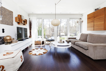 fancy living room with dark wooden floor and big window
