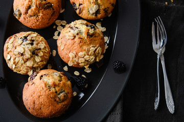 Homemade muffins with blackberries and chocolate.