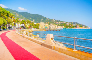 Fototapeta premium Beautiful city with sea, mountains and long red carpet walking, City it is a famous for vacations,holiday, in italy genova liguria.
