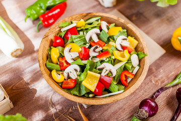 vegetable salad bowl on kitchen table, balanced diet