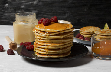 Fluffy cottage cheese pancakes with honey, jam, yogurt and fresh fruit