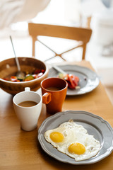 The morning Breakfast is two eggs, salad from fresh vegetables and coffee.