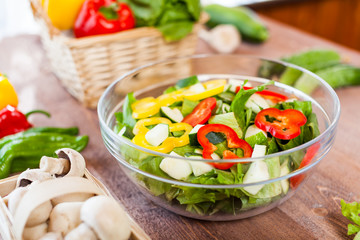 vegetable salad bowl on kitchen table, balanced diet