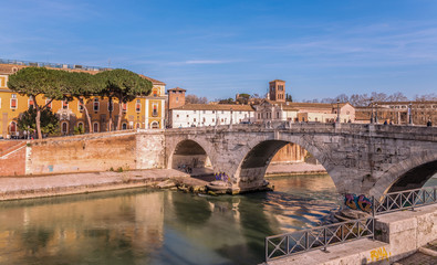 Fototapeta na wymiar Travel to Italy - St Angel Bridge (Ponte Sant Angelo, Aelian Bridge, Pons Aelius) on Tiber river in Rome city in winter