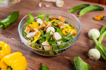 chicken salad bowl on kitchen table, balanced diet