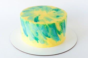 Cake with whipped yellow and green cream. Picture for a menu or a confectionery catalog.
