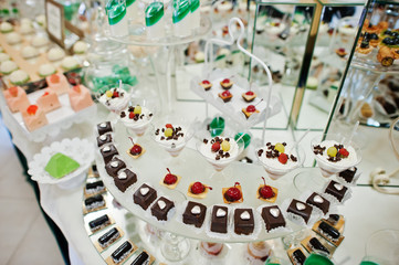 Good-looking and tasty desserts on the wedding banquet in the restaurant.