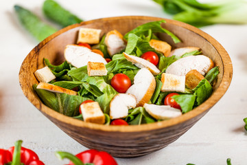 chicken salad bowl on kitchen table, balanced diet