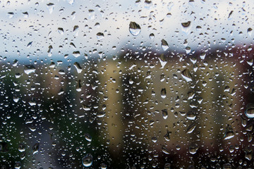Street of the city Through the window with drops after rain