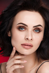 Obraz premium Face Skin Care. Woman With Beautiful Makeup And Eye Cream