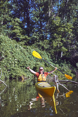 A canoe trip on the river in the summer.