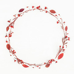 Autumn composition. Wreath made of autumn red leaves and flowers. Flat lay, top view, copy space, square