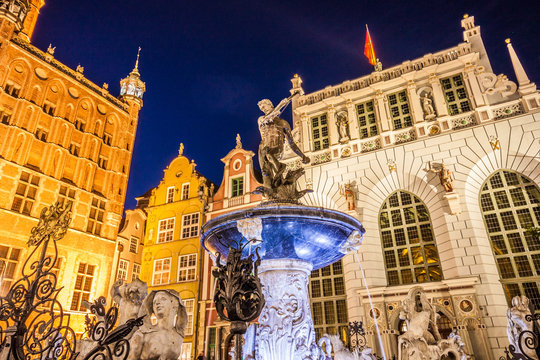 Beautifully illuminated Old Town in Gdansk with Neptune's statue. Poland