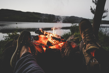 Couple on a lake with campfire in Swedish nature