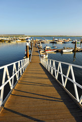 Obraz premium Jetty at the Olhao Marina, Ria Formosa Natural Park, Algarve, Portugal