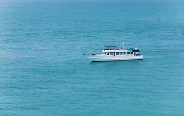 Boat on blue ocean.