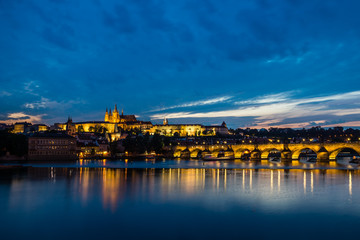 Fototapeta na wymiar Nigh view on the Hradcany Prague Castle, Church Saint Vitus and Charles Bridge in Prague, Czech Republic