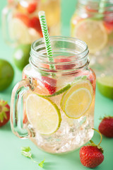 refreshing summer lemonade with strawberry and lime in mason jar