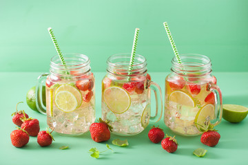 refreshing summer lemonade with strawberry and lime in mason jar