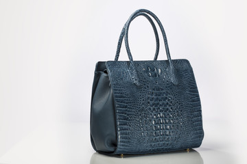 Blue Leather Crocodile Embossed women handbag on White background