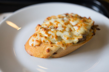 Bruschetta with baked mushrooms and  cheese