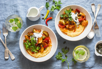 Mexican style spicy ratatouille with polenta on a blue background, top view. Flat lay
