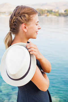 Young woman relaxing by the seaside in Croatia