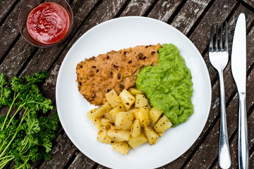 Breaded Haddock Fillet With Parmentier Potatoes And Pea Puree