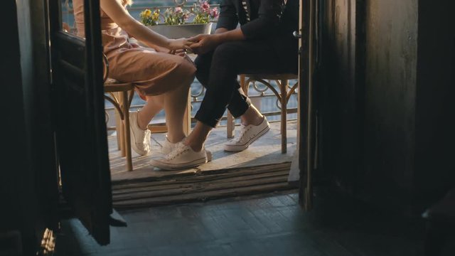 Touching feet couple in love. Romantic kisses loving couple