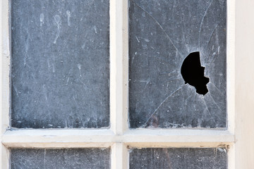 Broken pane of glass in an old window