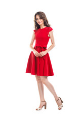 Happy beautiful woman in red dress isolated on white background