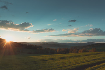Naklejka na ściany i meble Beautiful photography of sunset in Karkonosze Mountains at sunny warm day, Poland Lubawka.