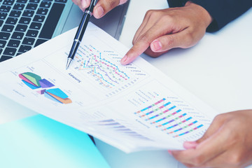 Business concept : Businesswoman pointing figure numbers of total sales comparing between global regions