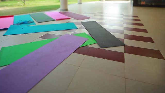 Yoga mats lie on the floor in nature