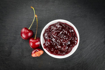 Some Cherry Jam on a dark slate slab