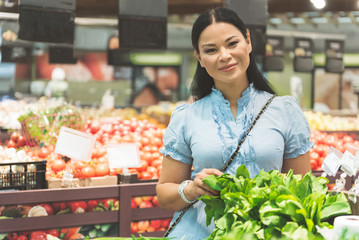Cheerful client making choice in grocery