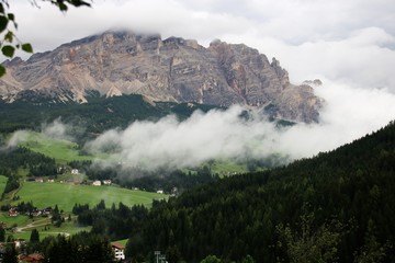 Misty and cloudy alpine landscape