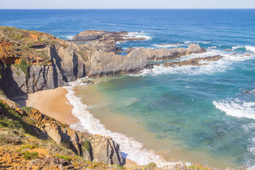 Wave and cliffs in the Beach in Almograve