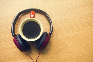 coffee hot cup with music headphone in holiday concept