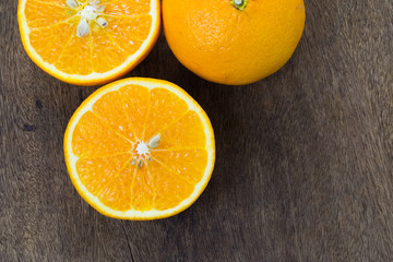 Orange, half of orange, oranges on the wooden table