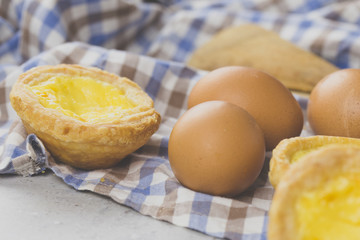 typical Portuguese egg tart pastries from Lisbon on a set table