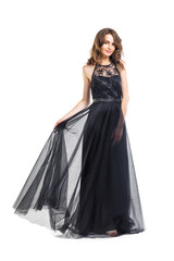 Full length portrait of young beautiful woman in black evening dress
