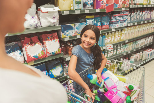 Brightly Smiling Female Child Doing Shopping With Mom