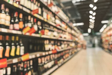 Plexiglas foto achterwand Different alcohol bottles in supermarket © Yakobchuk Olena