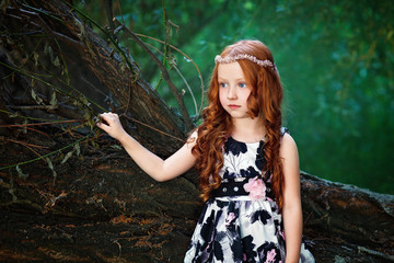 Little girl in magic forest