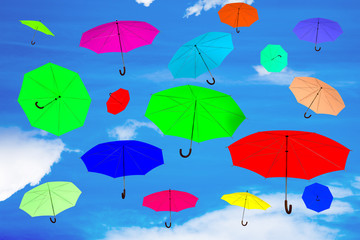 Fototapeta na wymiar Clamped umbrellas flying through the air