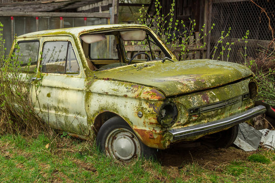 Abandoned car in rust and moss 1
