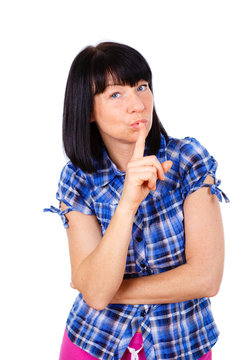 Portrait of mature woman keeping finger on her lips and asking to keep quiet, isolated over white background